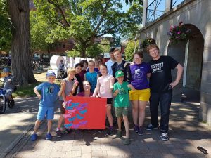 Summer Students Hannah and Zach (right) and former Executive Director Ruth Murgatroyd (centre) with students participating in summer camps during 2017.